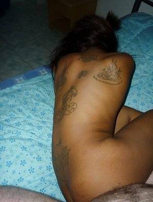 Tattooed Thai girl Nit getting banged bareback on bed by sex tourist - Thailand on www.girlzfan.com
