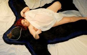Fat redhead Black Widow AK models totally naked on a bearskin rug on girlzfan.com