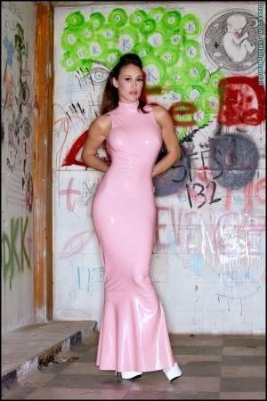 Latina beauty Ryan Keely inserts a vibrator after removing a long latex dress on girlzfan.com